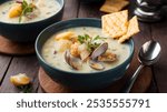 Clam Chowder: A creamy New England soup made with clams, potatoes, onions, and sometimes bacon, served hot with crackers.