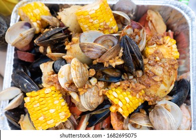 Clambake with clams, garlic, shirmp, crab