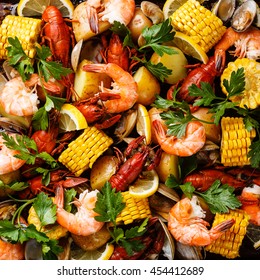 Clambake Seafood Boil With Corn On The Cob, Potatoes, Prawns, Crayfish And Clams