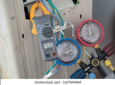 Clamp amp meter, electrician use Clamp amp meter for check or measureing the current of electrical motor system. Clamp meter measure current on cable on power supply devices