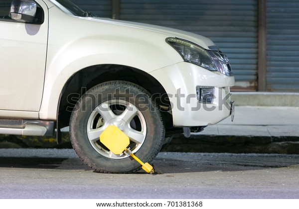 Clamped front\
wheel. Wheel locks, concept of car.\
