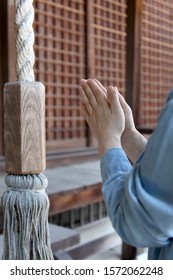 Clap the hands in prayer at a Shrine