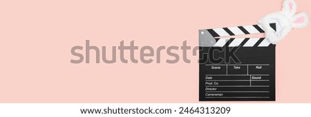 clapper board and easter bunny ears, movie production, entertainment industry, action scene,holiday decoration, happy celebration, entertainment banner