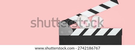clapper board and easter bunny ears, movie tickets, entertainment discount, happy holiday, video production, cinematography, camera clap