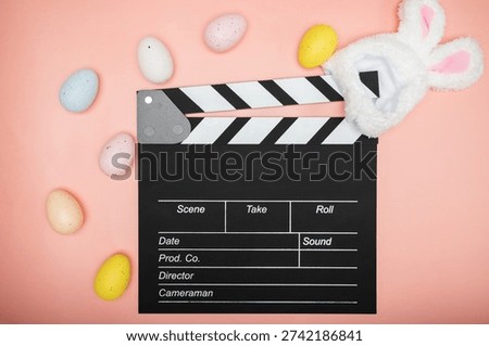 clapper board and easter bunny ears, film industry, production studio, movie scene, entertainment motion, action clapboard