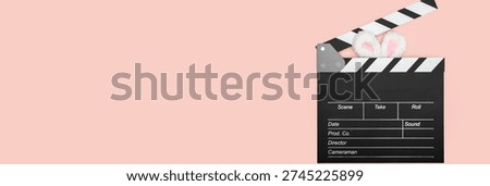 clapper board and easter bunny ears, cinema ticket sale, movie discount, spectator excitement,film studio, motion picture, Hollywood production