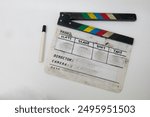 clapper board with marker, clapper board worn out from frequent use, film production equipment