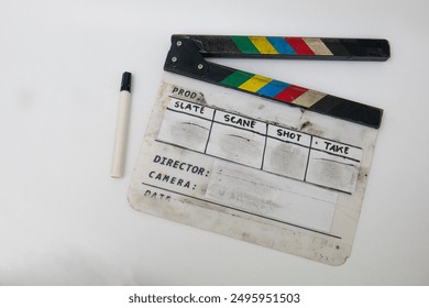 clapper board with marker, clapper board worn out from frequent use, film production equipment