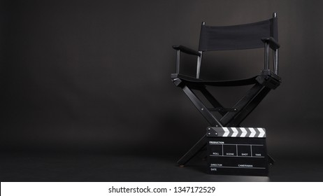 Clapperboard or movie slate with director chair use in video production or movie and cinema industry. It's black color. - Shutterstock ID 1347172529