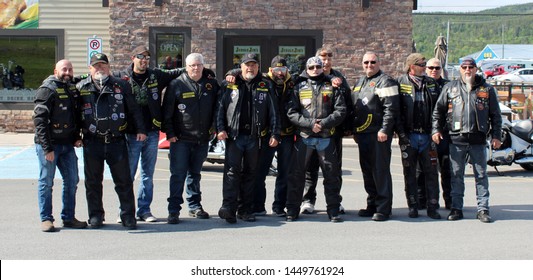 Clarenville Newfoundland & Labrador - July 13, 2019 - The Chrome Warriors Riding Motorcycle Club Gang shown posing for photograph dressed in full leather and riding gear and boots.