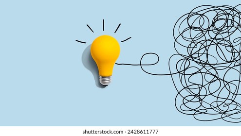 Clarifying complex ideas theme with light bulb - Flat lay