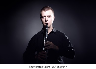 Clarinet Player Classical Musician Portrait. Clarinetist Playing Woodwind Musical Instrument