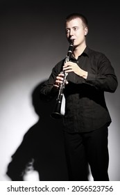 Clarinet Player Classical Musician Portrait. Clarinetist Playing Woodwind Musical Instrument