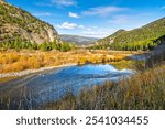 The Clark Fork River as it runs through the mountains of Western Montana near Missoula, Montana at autumn.