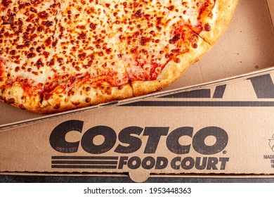 Clarksburg, MD, USA 04-7-2021: Closeup Flat Lay Top View Image Of A Carton Box Of Delicious Made To Order COSTCO Cheese Pizza. Very Popular Bargain Priced Food Court Item From The Wholesale Giant. 