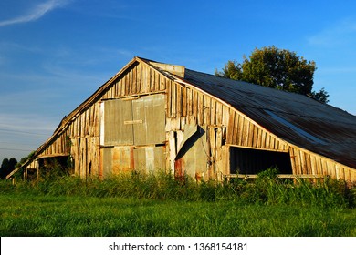 Clarksdale, MS, USA A Weathered And Dilapidated Barn Barely Stands In A Field In Clarksdale, Mississippi