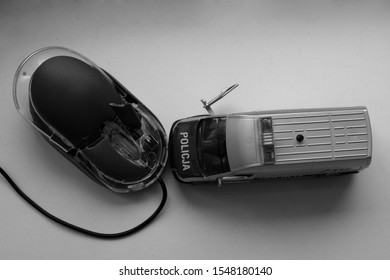 Clash Of Technology And Law (computer Mouse Destroyed In Collision With The Police Car)