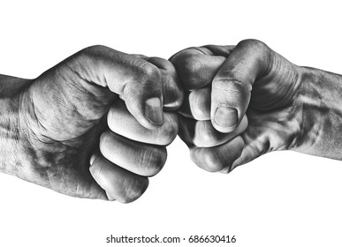Clash of two fists on white, isolated background. Concept of confrontation, competition etc.