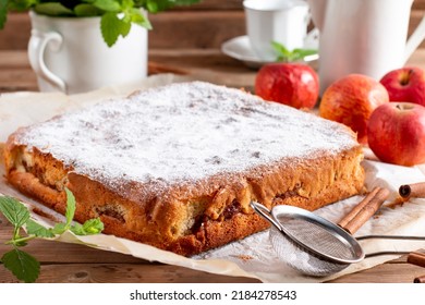 Clasic sponge cake with apples on wood table, selective focus. Homemade cake - Shutterstock ID 2184278543