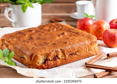 Clasic sponge cake with apples on wood table, selective focus. Homemade cake - Shutterstock ID 2195396975