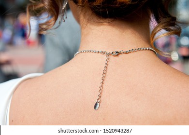 Clasp Chain Jewelry Necklace On The Neck Of A Young Girl.