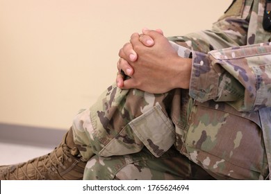 Clasped Hands Of A Military Health Care Provider In Uniform During The Covid-19 Pandemic.