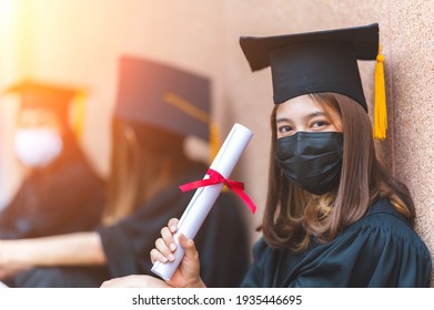 The Class Of 2021,group Of Graduates Asian Student Wear A Mask At A Distance At The Graduation Ceremony At The University