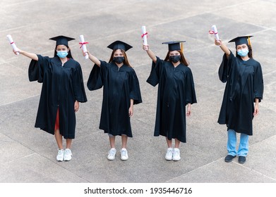 The Class Of 2021,group Of Graduates Asian Student Wear A Mask At A Distance At The Graduation Ceremony At The University