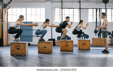 Class, fitness and squat with people in gym for exercise, strong and workout. Coaching, health and personal trainer with group of friends training for muscle challenge, motivation and bodybuilder - Powered by Shutterstock