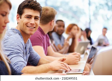 Class Of University Students Using Laptops In Lecture