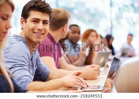 Class Of University Students Using Laptops In Lecture