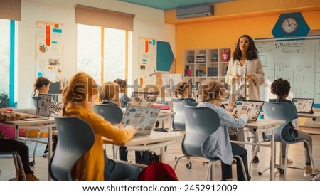 Similar – Image, Stock Photo Teacher explaining types of renewable energies in poster at ecology classroom