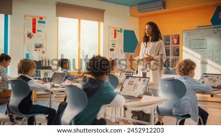Image, Stock Photo Teacher explaining types of renewable energies in poster at ecology classroom