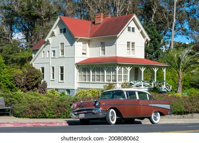 Classic 1957 Chevrolet Bel Air Four Door Sedan Parked On On The Street In Front Of Eclectic Queen Anne Architecture Style Historic Home - San Francisco, California, USA - 2021