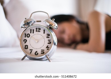 Classic alarm clock with girl in black dress. - Shutterstock ID 511408672