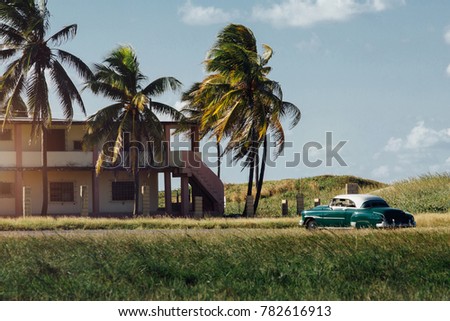 Classic american car parked house palm trees. cuba. Beautiful view, sunset. Dream Copy space.