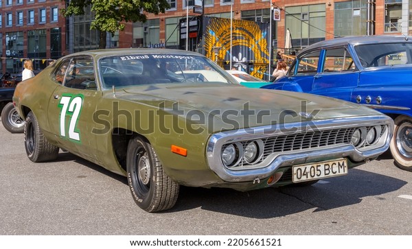 Classic american muscle car Plymouth Road Runner\
second generation 1971 on Original Meet Show. Russia, St.\
Petersburg, September 10,\
2022