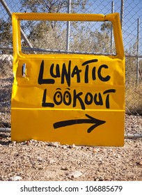 Classic Australian Outback Bush Humor, With A Car Door Pointing To Lunatic Lookout