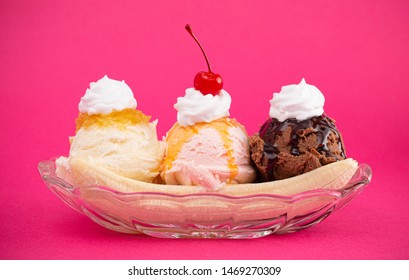 A Classic Banana Split On A Bright Pink Background