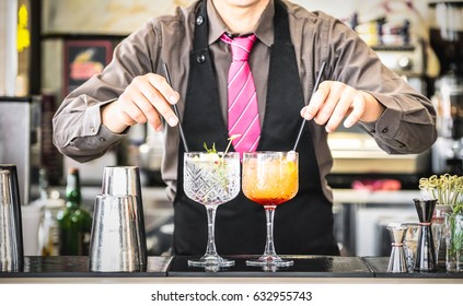 Classic Bartender Serving Gin Tonic And Tequila Sunrise With Straw On Drink Glasses Cups At Fashion Cocktail Bar - Food And Beverage Concept With Professional Barman Working At Mixology Restaurant