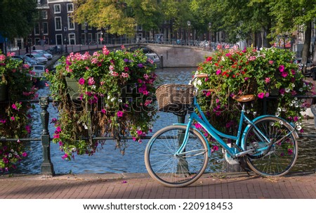 Classic bicycle parked on canal bridge, Amsterdam, Netherlands