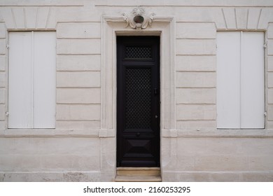 Classic Black Home Entrance Wooden Door On French Wall Street Facade