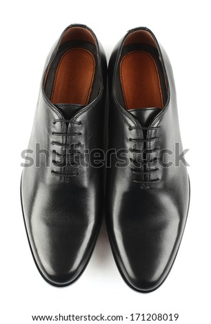 Classic black leather mens shoes with laces isolated on white background top view