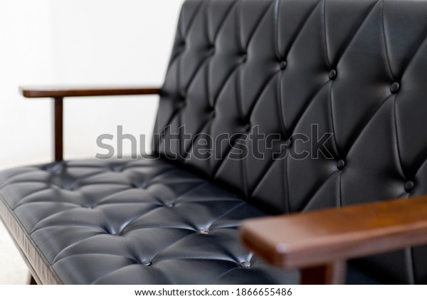 Classic black leather upholstery. quilted leather\
texture. upholstery\
pattern