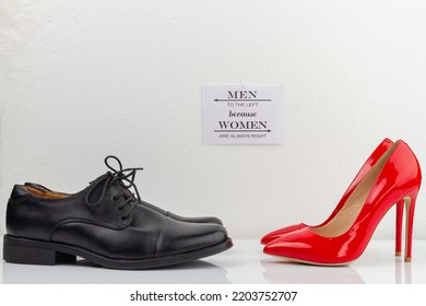 Classic black mens shoes and red high heel womens shoes. Men to the left because women are always right inscription.