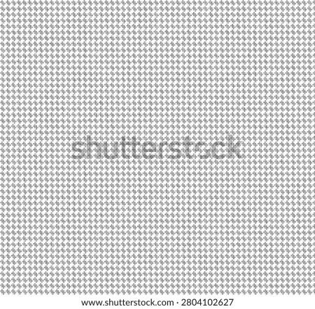 Classic black and white houndstooth pattern fabric texture background.