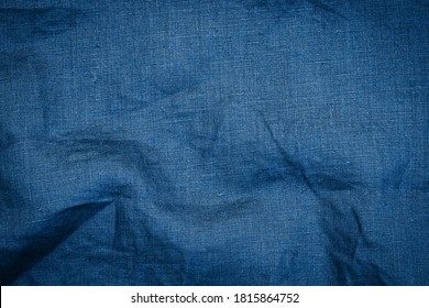 Classic Blue Color Trend Of 2021 Year. Linen  Cloth Blue Texture Background. Wrinkled Linen Dark Blue Fabric. 