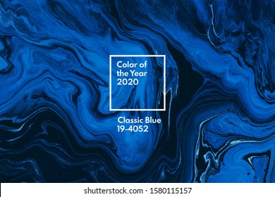 Classic blue color of the year 2020. Bright blue and white marble background. Liquid stripy minimalistic trendy paint texture. Abstract fluid art. Acrylic and oil flow modern creative backdrop