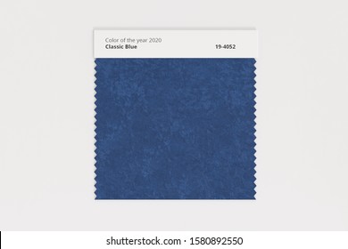 Classic blue. The color of the year 2020. Dark blue piece of fabric. Textile swatch mock-up. Trendy color palette. 