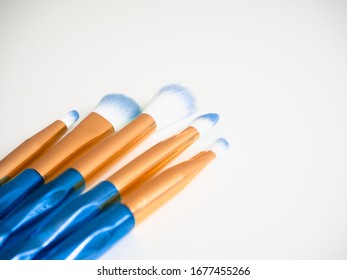 Classic Blue Eyeshadow Brushes Isolated On White Background With Space For Copy Space.